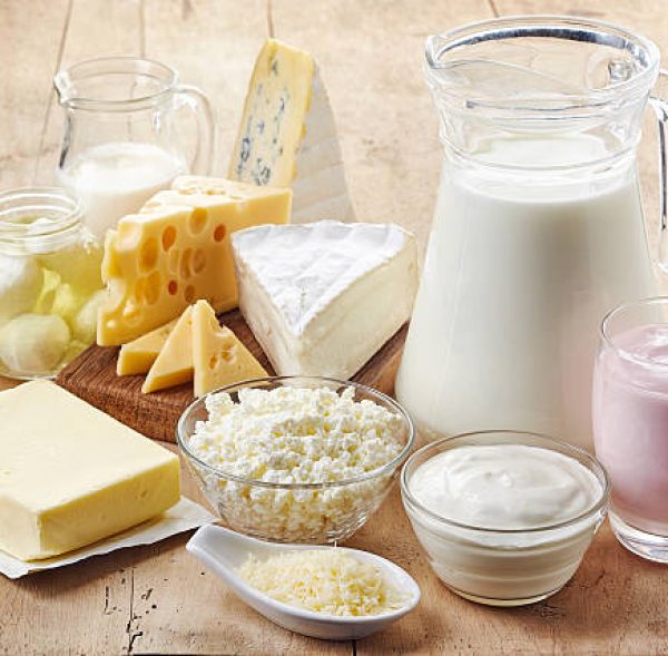 Various fresh dairy products on wooden background